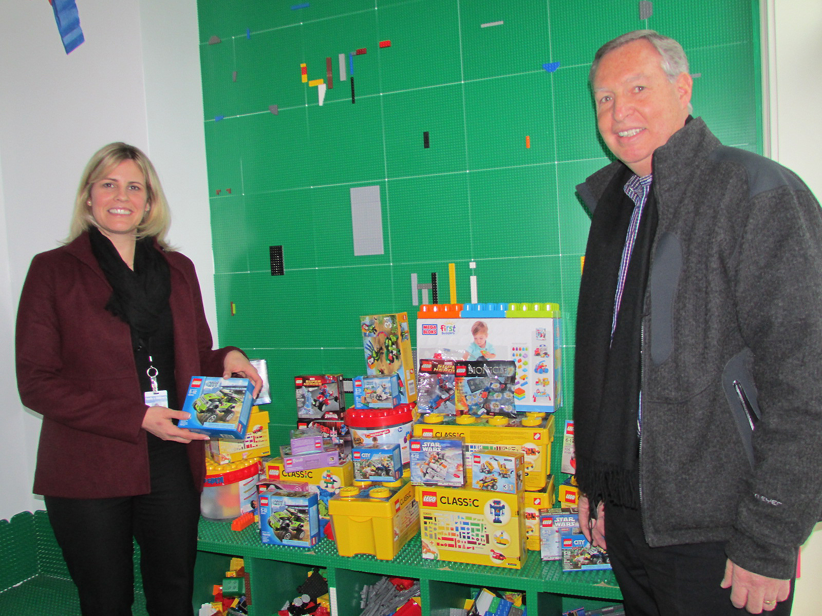 Apacet Senior Vice President Bob Fielding drops off two boxes of Legos donated by the staff of Ampacet